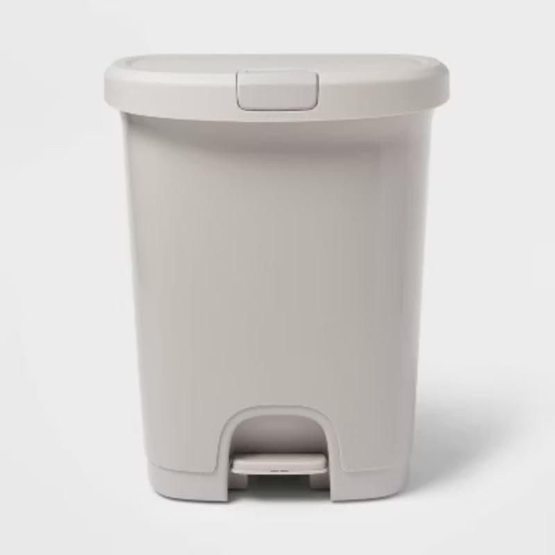 Gray plastic step on trash can locking lid